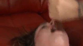 Tattooed brunette getting her face totally ruined with dick on sofa