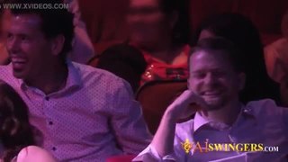 Swinger lady is pull out to the stage to show some sex positions.