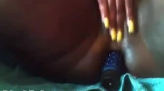 Busty black babe toys both holes