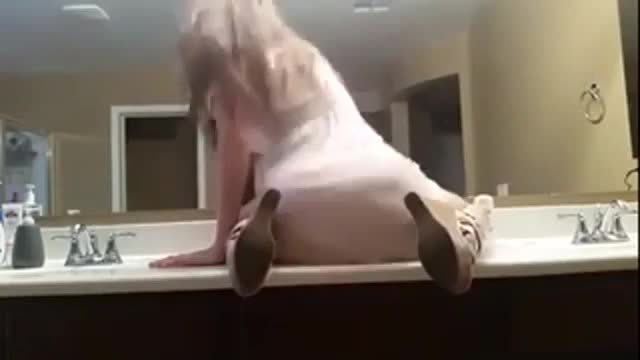 Crazy slut talking dirty in the bathroom mirror while stripping - plenty more at poontangclan.us
