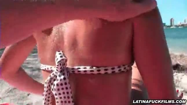 Latina hottie sucks dick on the beach